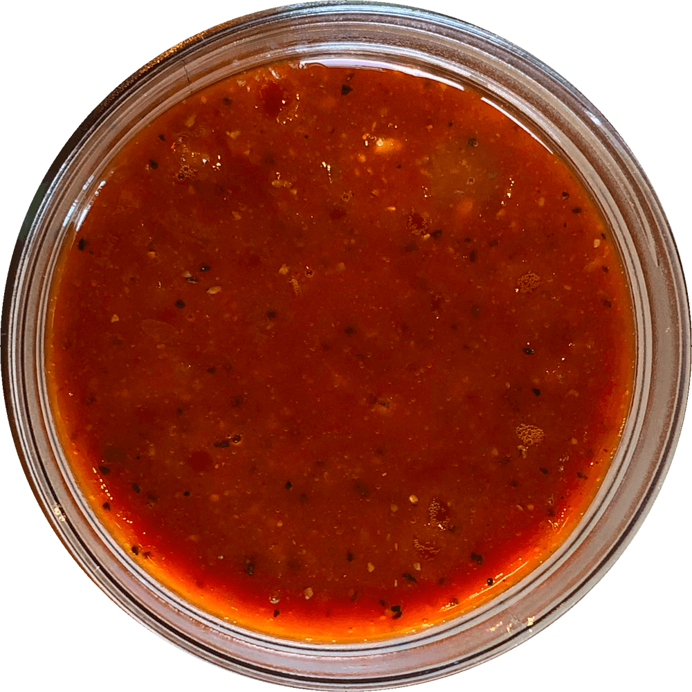 a close up of a sauce cup