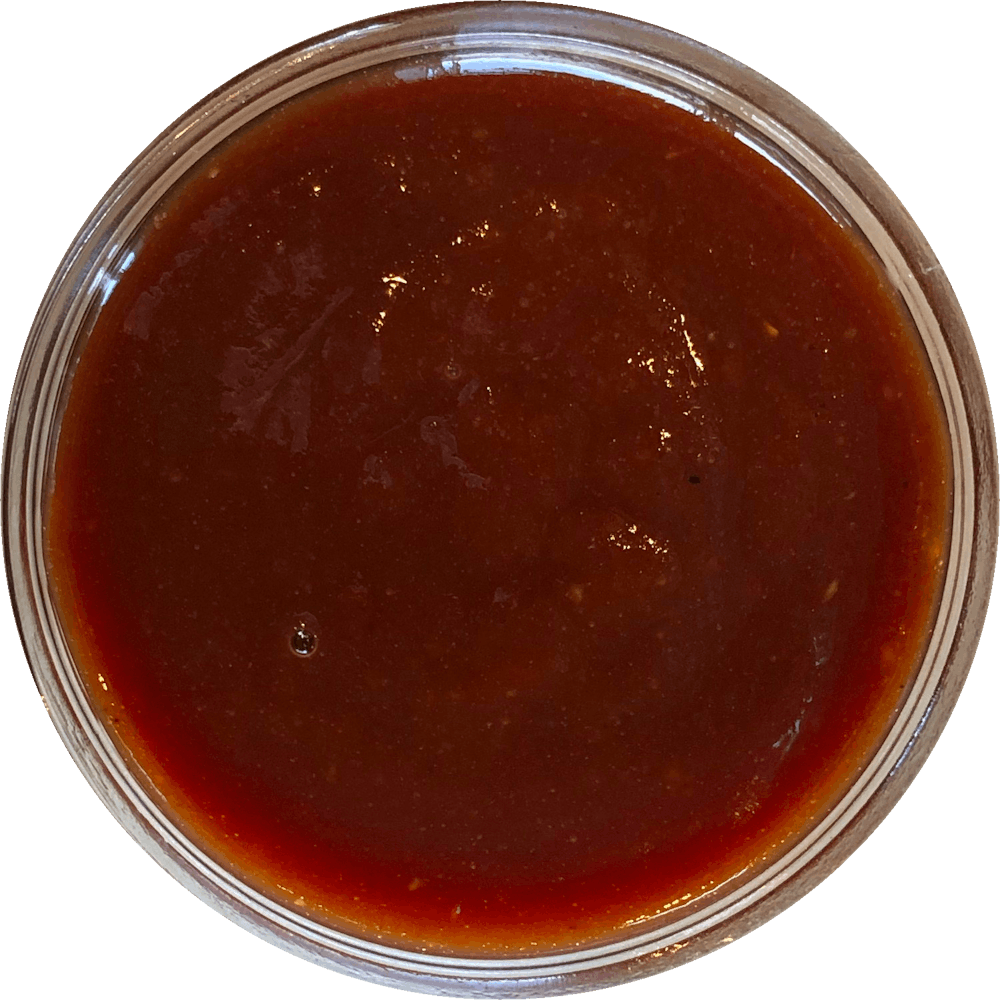 a close up of a sauce cup