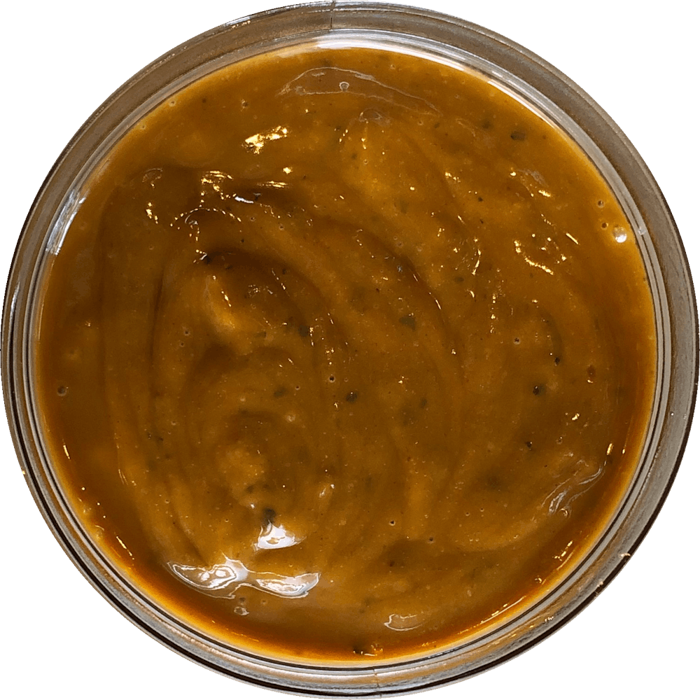 a close up of a sauce cup