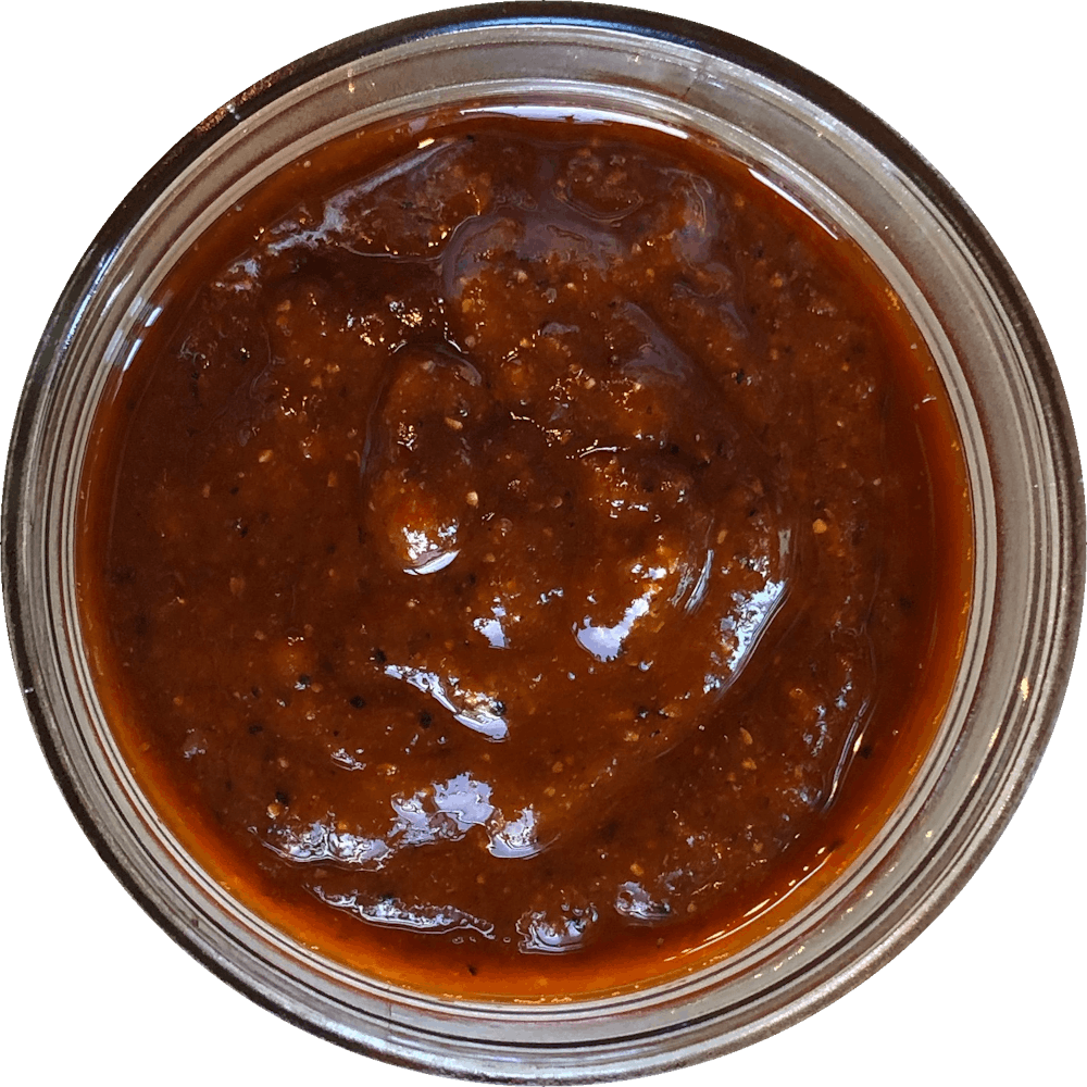 a close up of a sauce cup