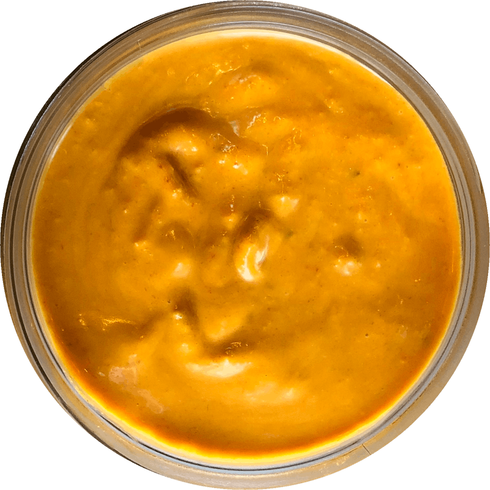 a close up of a sauce cup