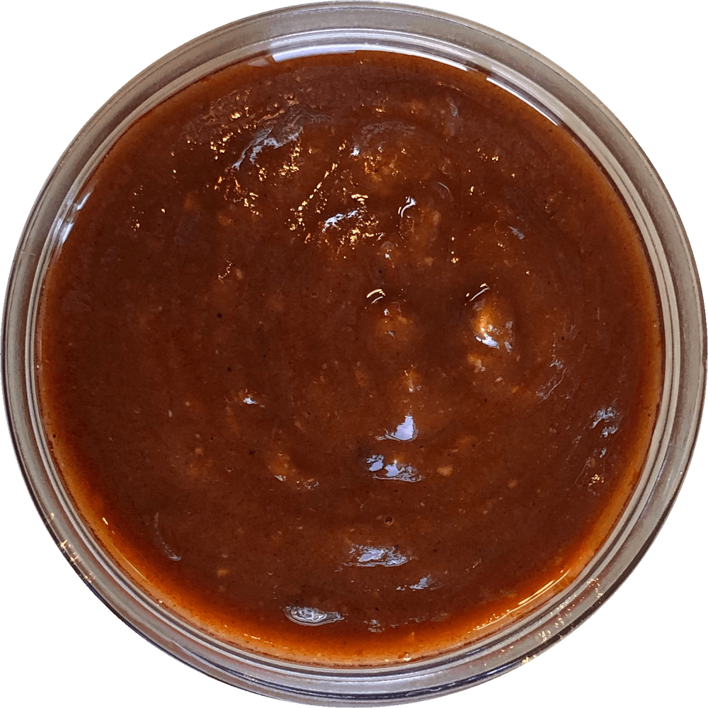 a close up of a sauce cup