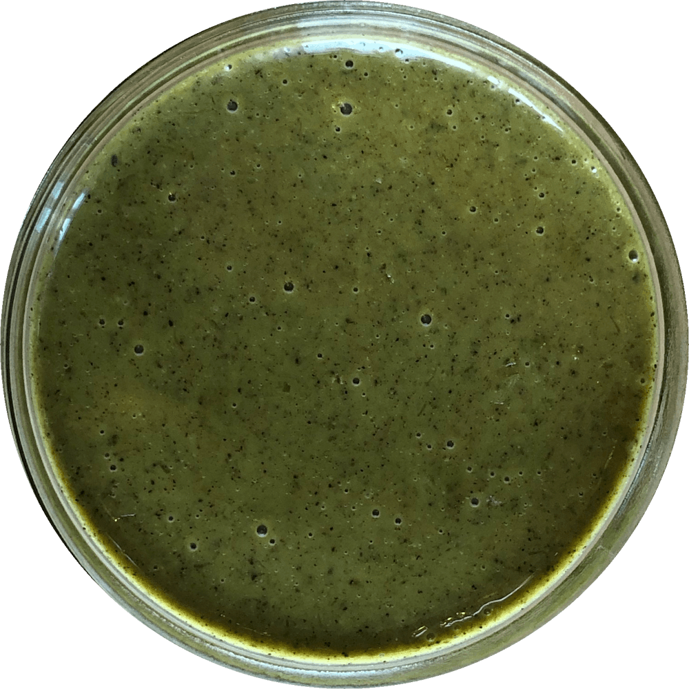 a close up of a sauce cup