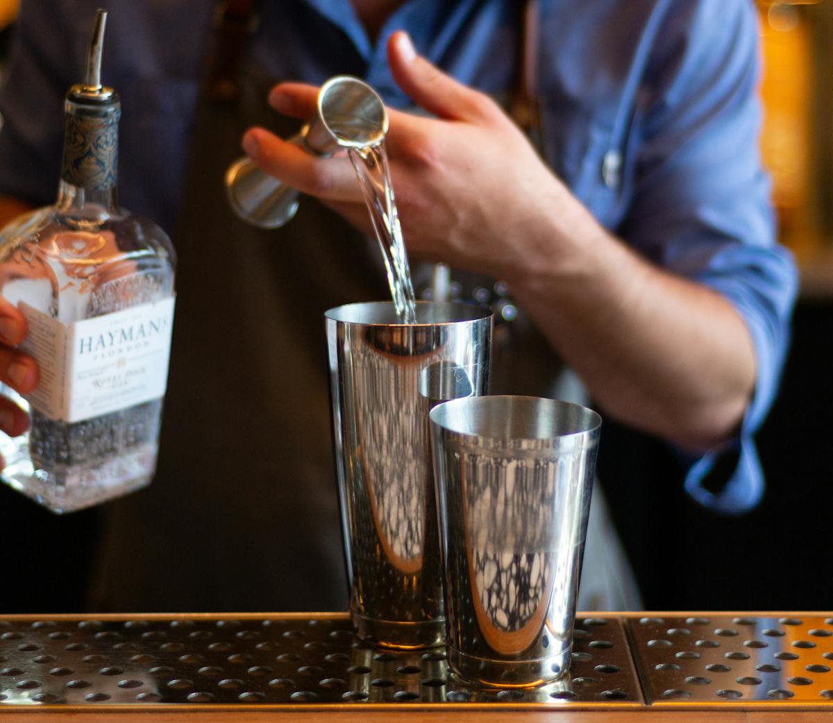 a bartender preparing a drink