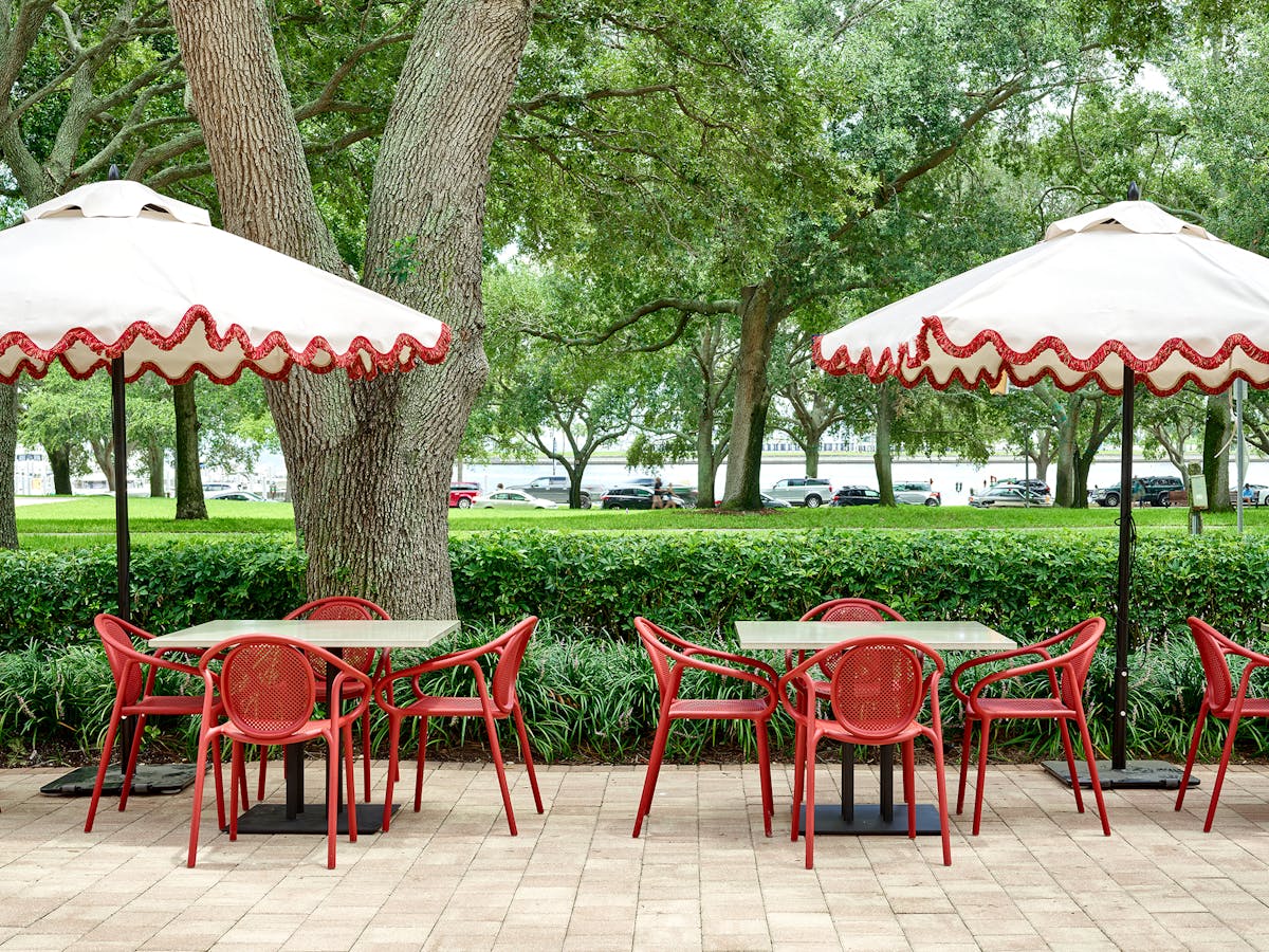 a group of lawn chairs sitting on top of a picnic table