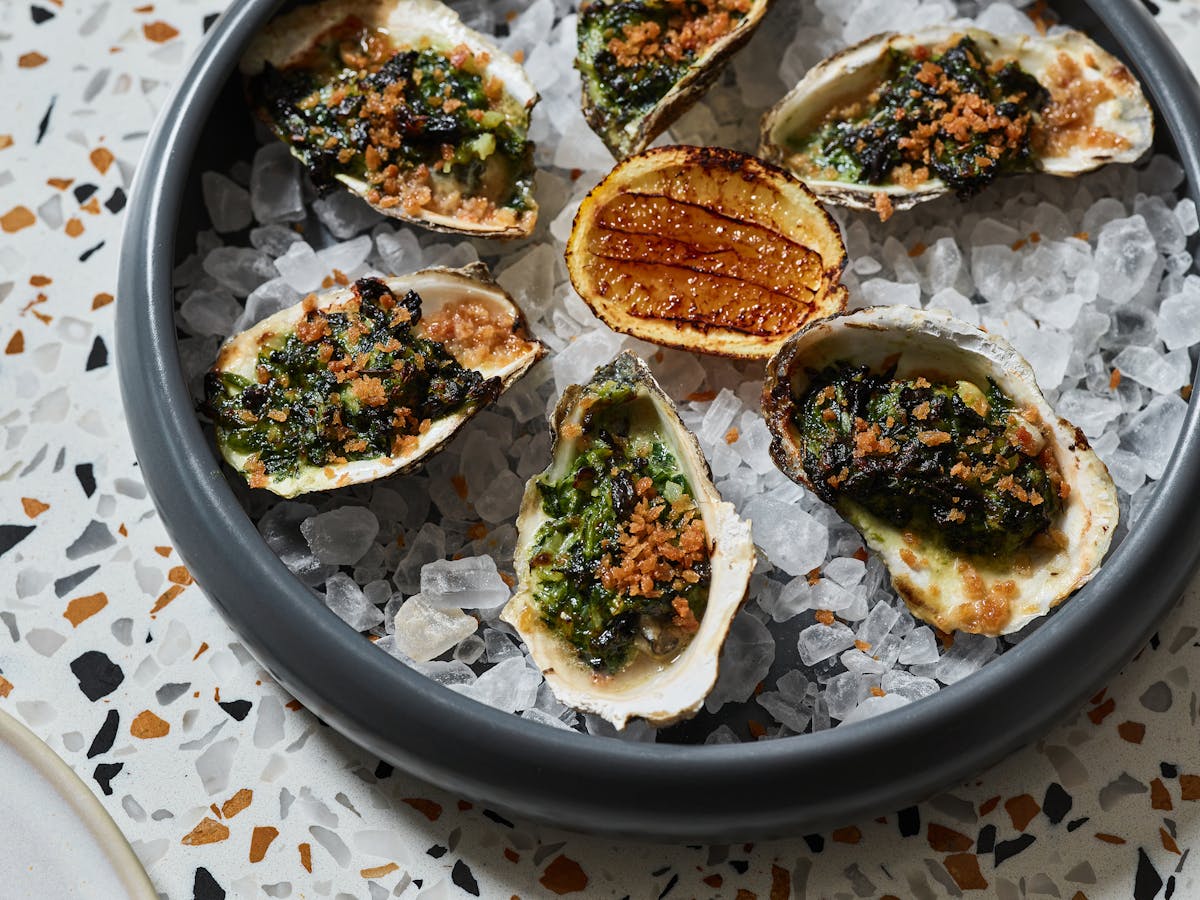 a plate of oysters on a table