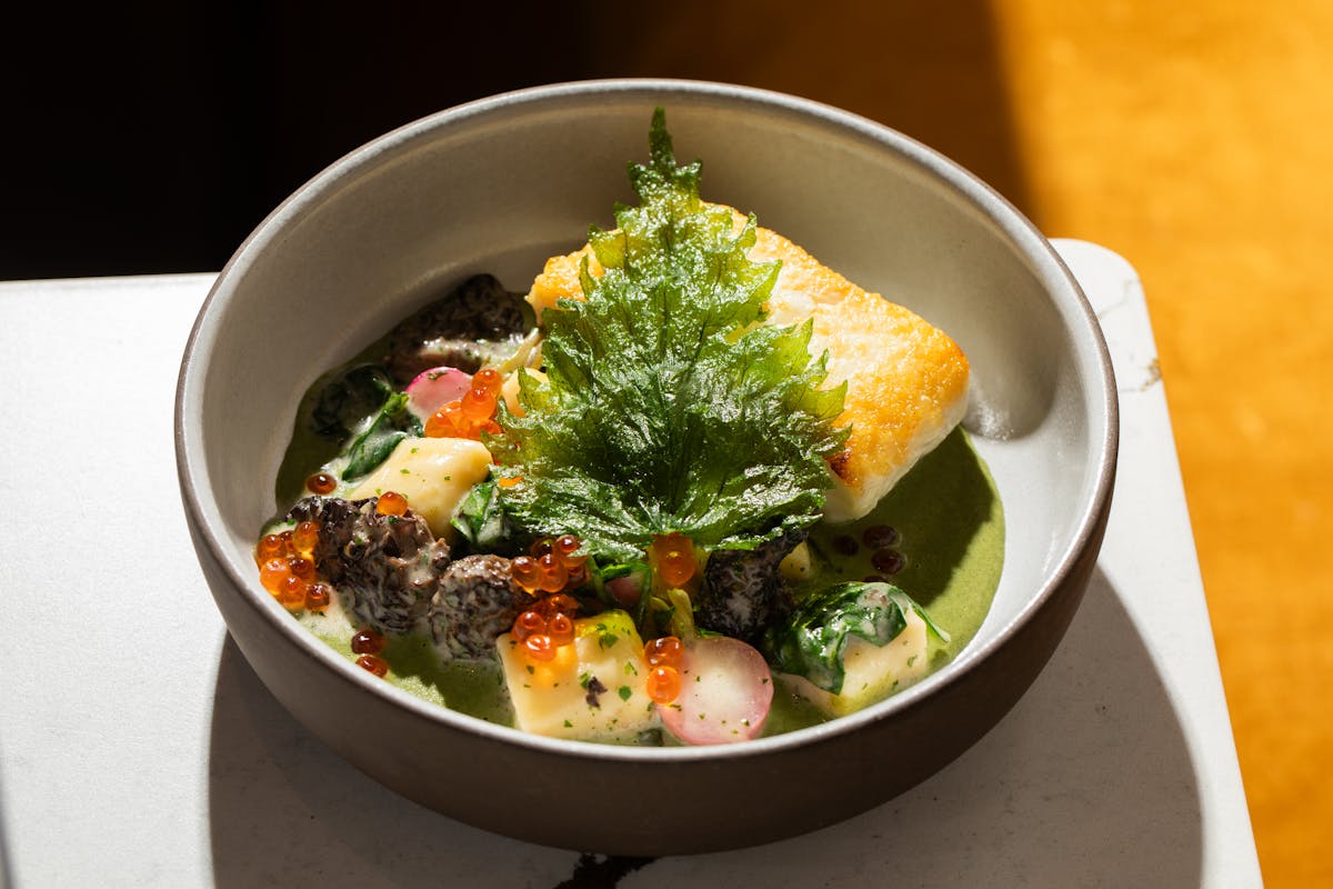 a bowl of food with broccoli