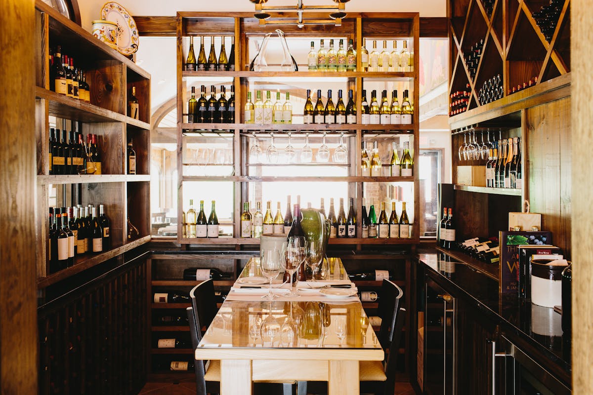 a kitchen with wooden cabinets and a table in a restaurant