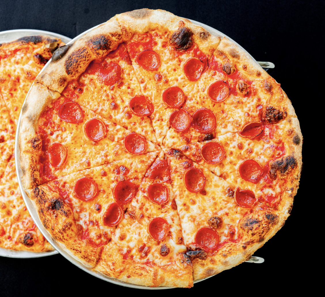 a pepperoni pizza on plates