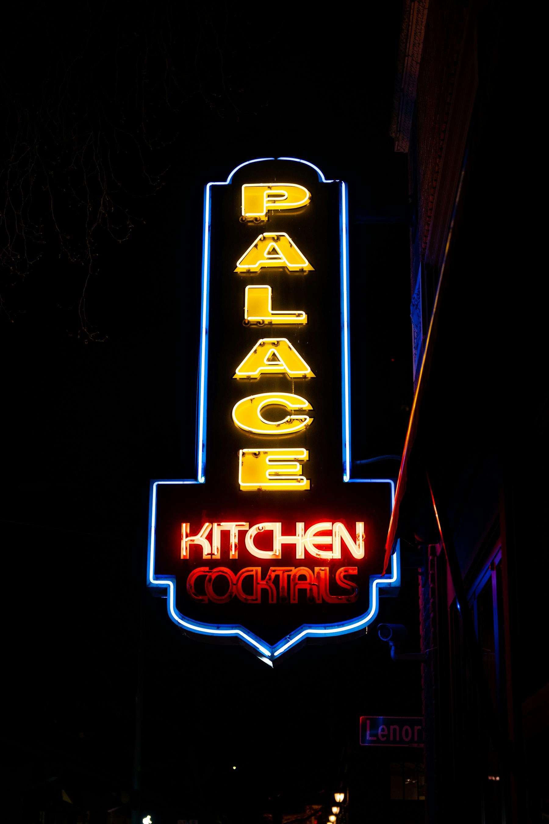a sign lit up at night