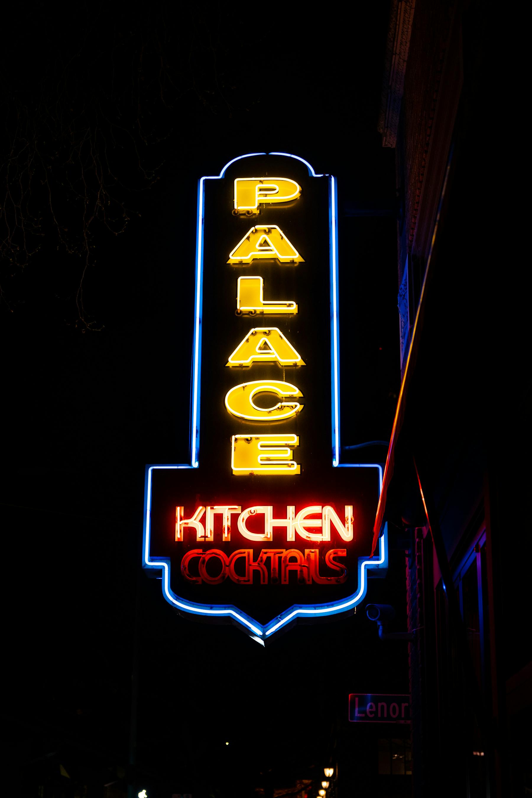 a sign lit up at night