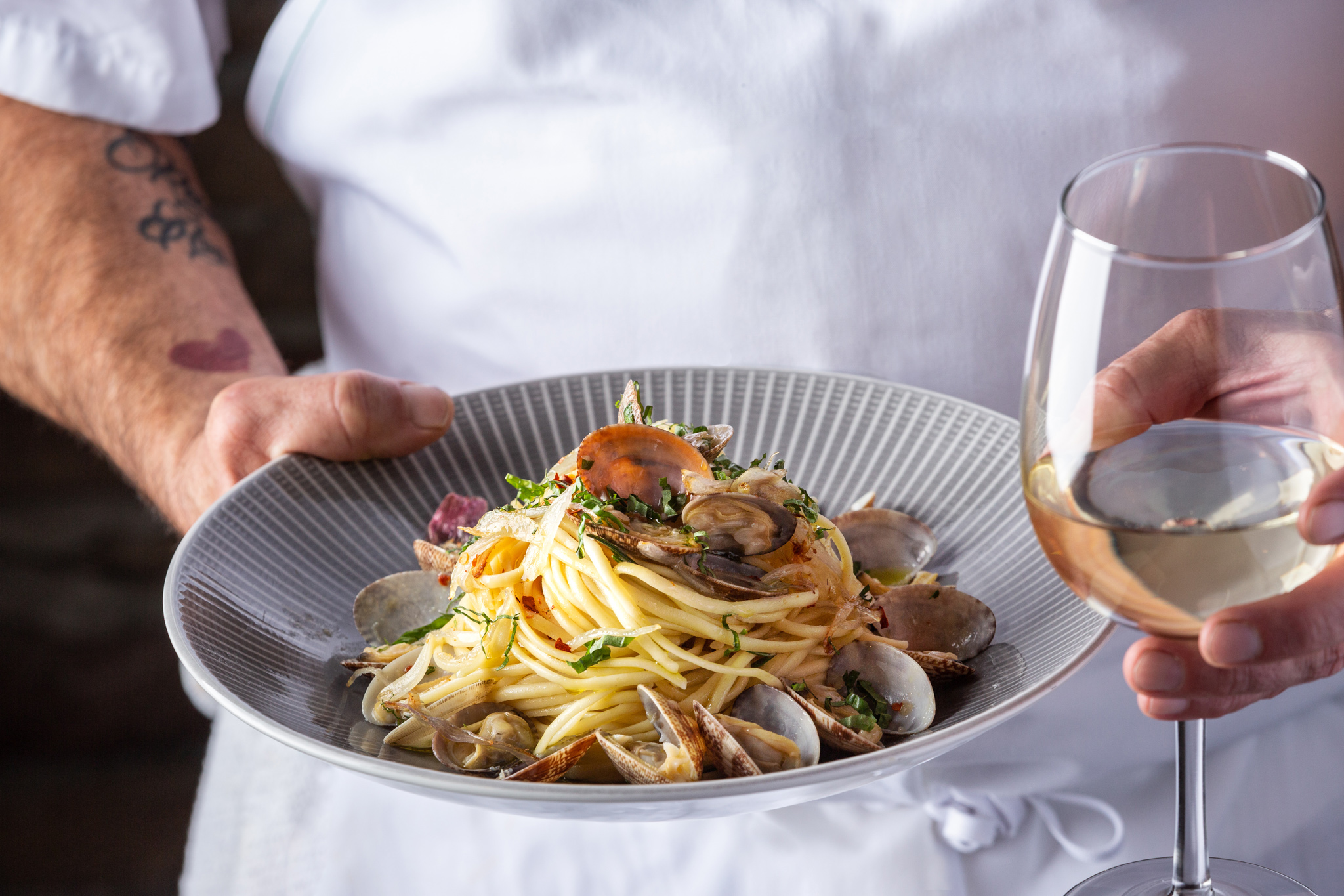 a plate of food with a glass of wine
