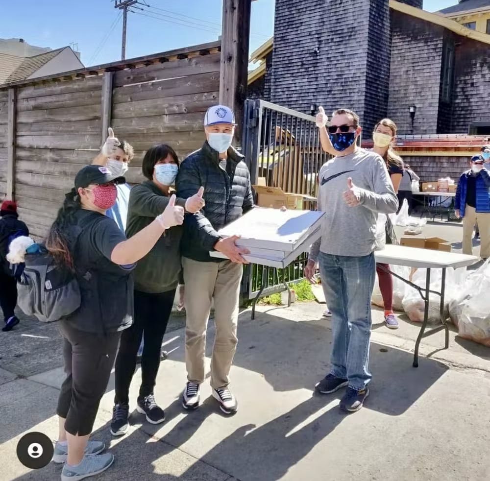 a group of people standing in front of a building