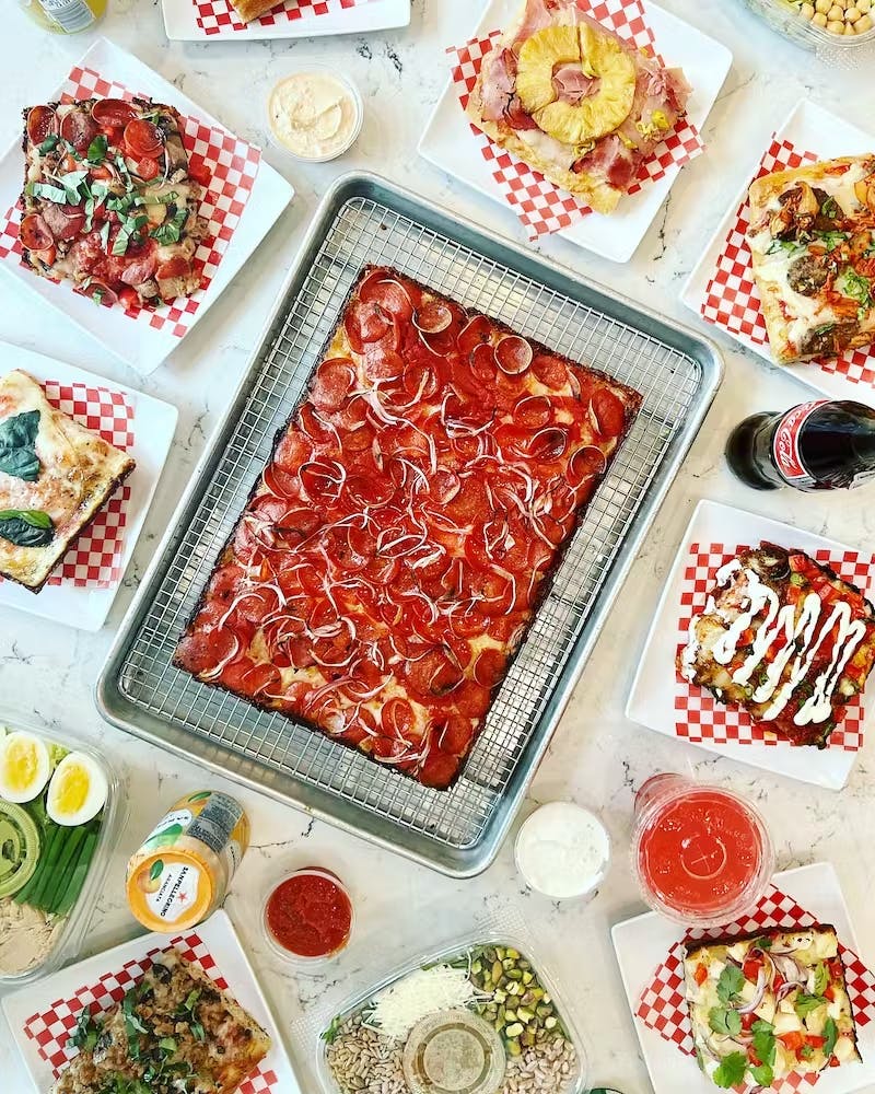 a close up of many different types of food on a table