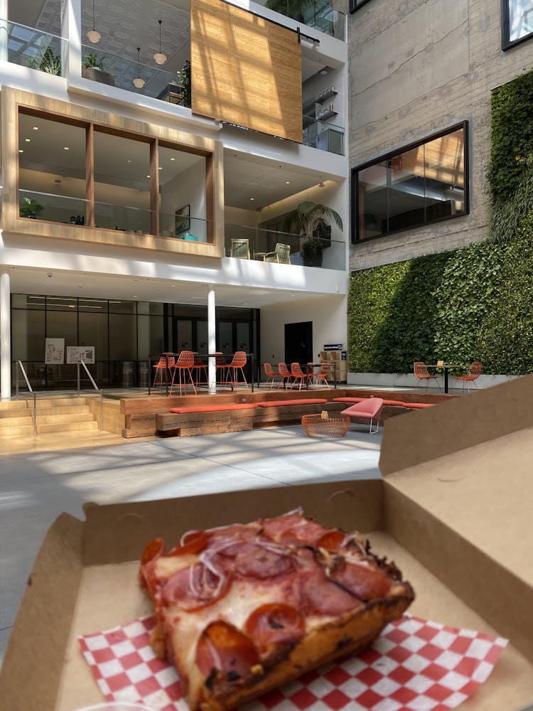 a pizza sitting on top of a building