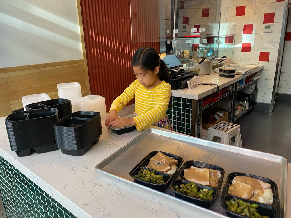 a person sitting at a table with food