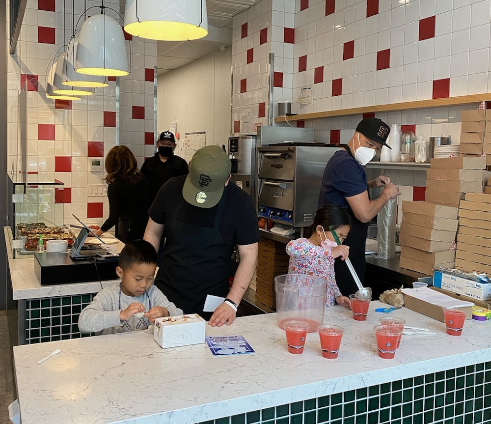 a group of people performing on a counter