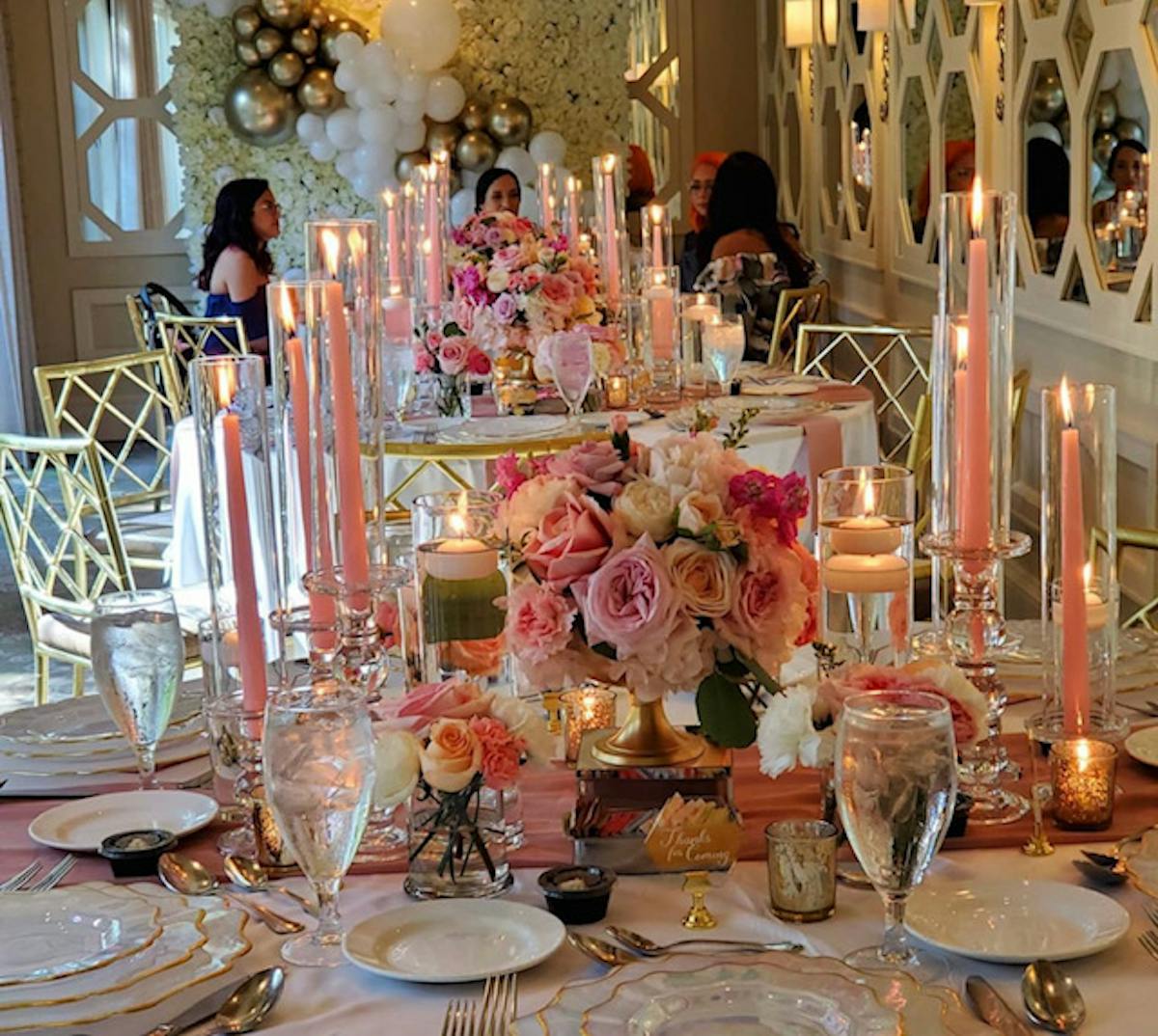 a group of people sitting at a table with wine glasses