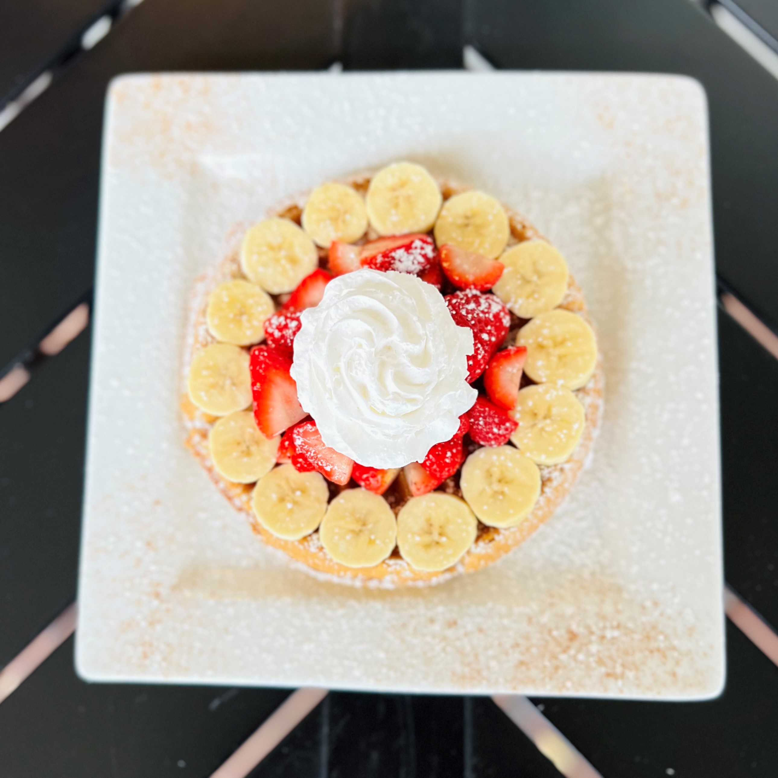 a cake sitting on top of a wooden table