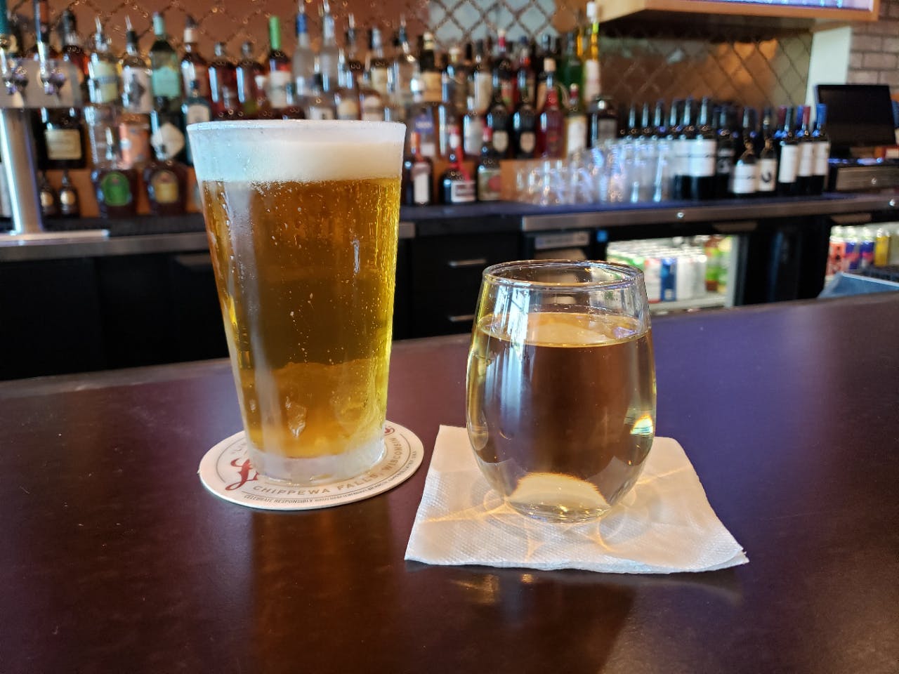 a glass of beer on a table