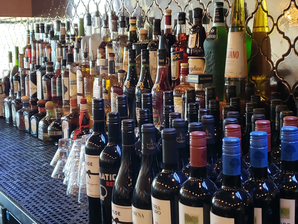 a row of wine glasses on a table