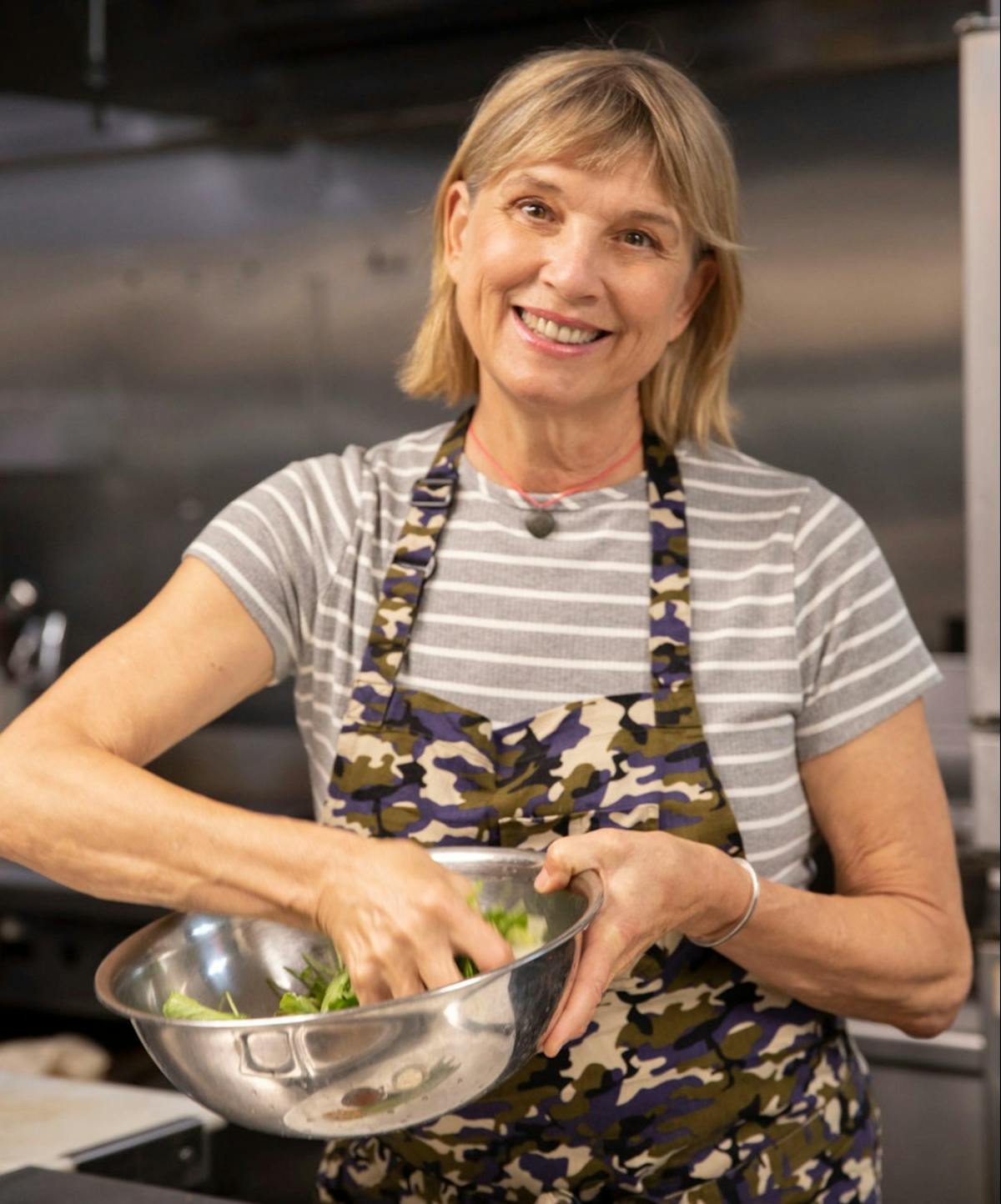 Mary Sue Milliken cooking in the kitchen