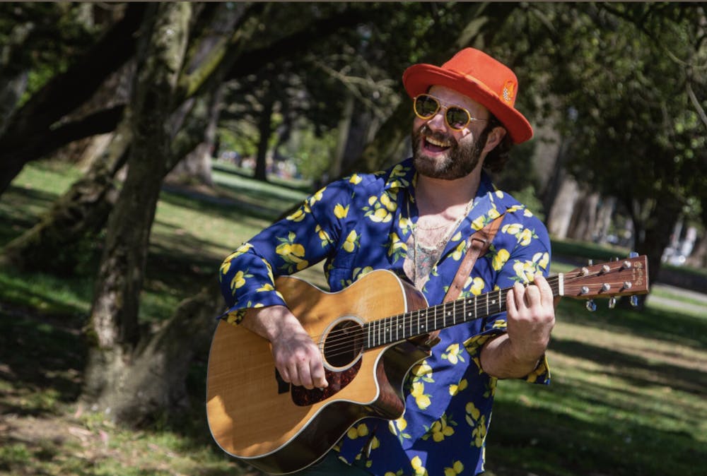 a man holding a guitar