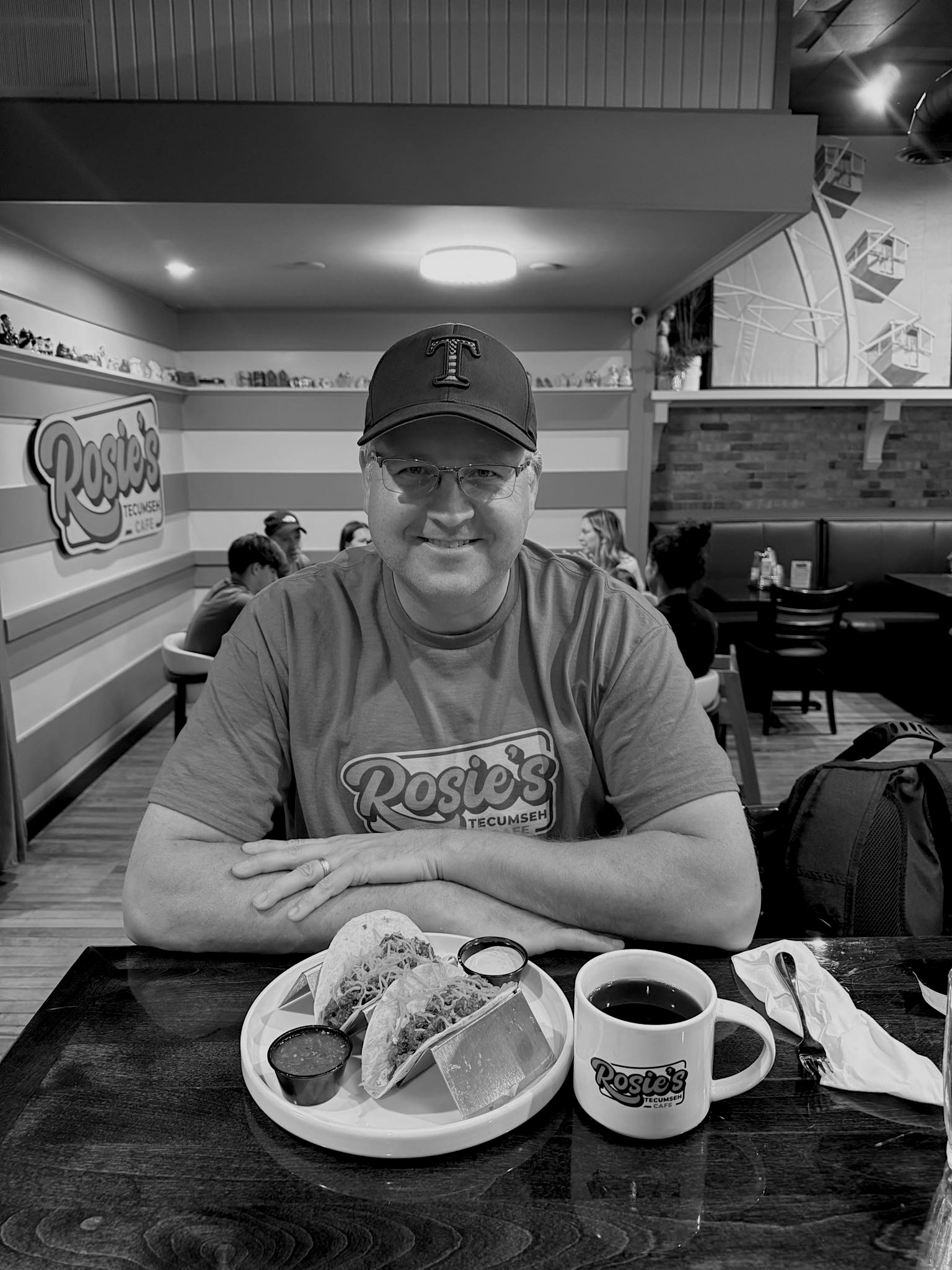 a man sitting at a table with food