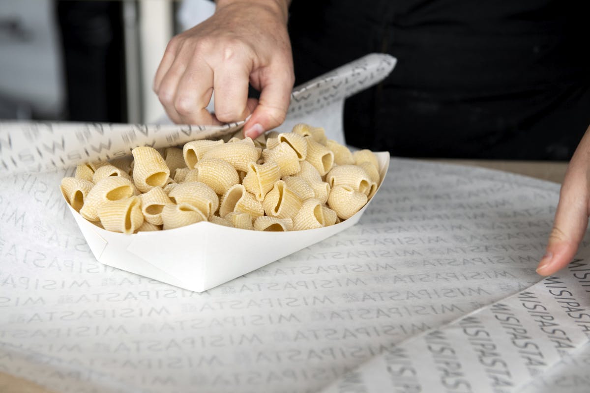 a person cutting a piece of paper