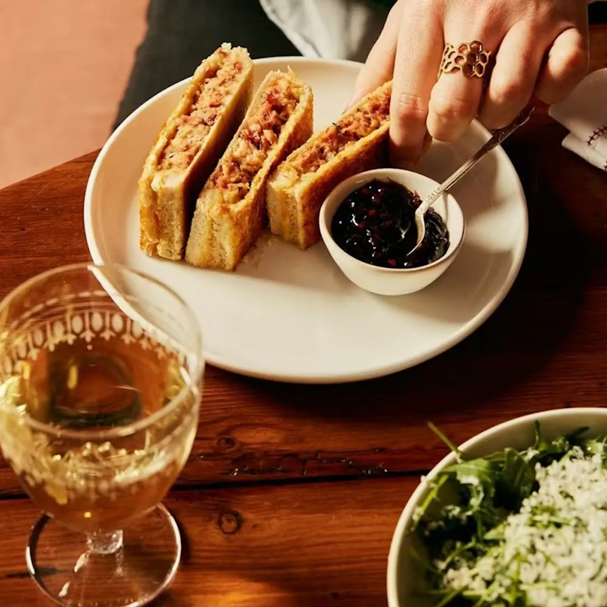 a plate of ham & cheese toasties on a table
