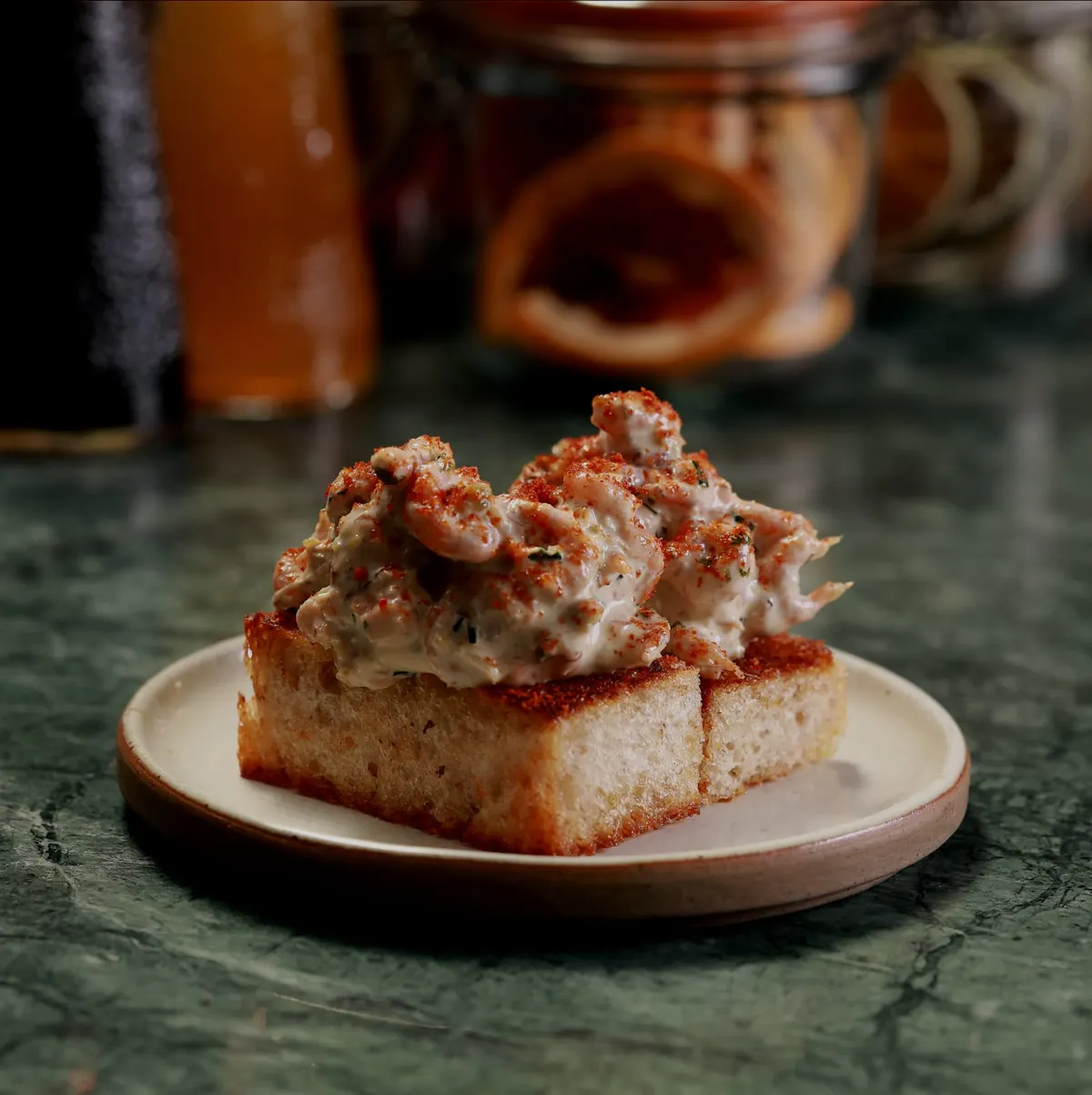 a snack dish of devilled shrimp at Cora Pearl