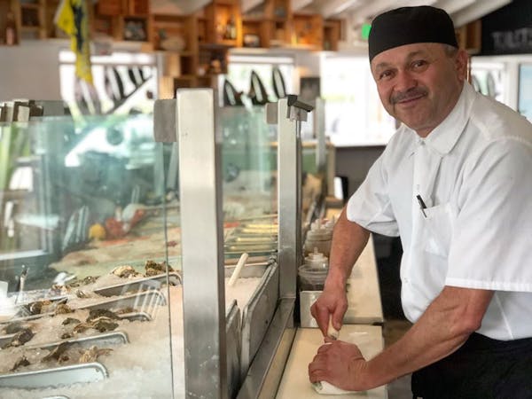 a man preparing food inside of it