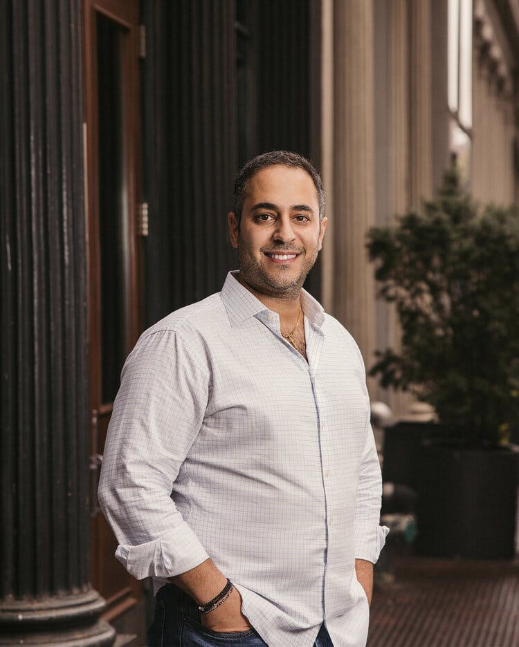 a man standing in front of a building