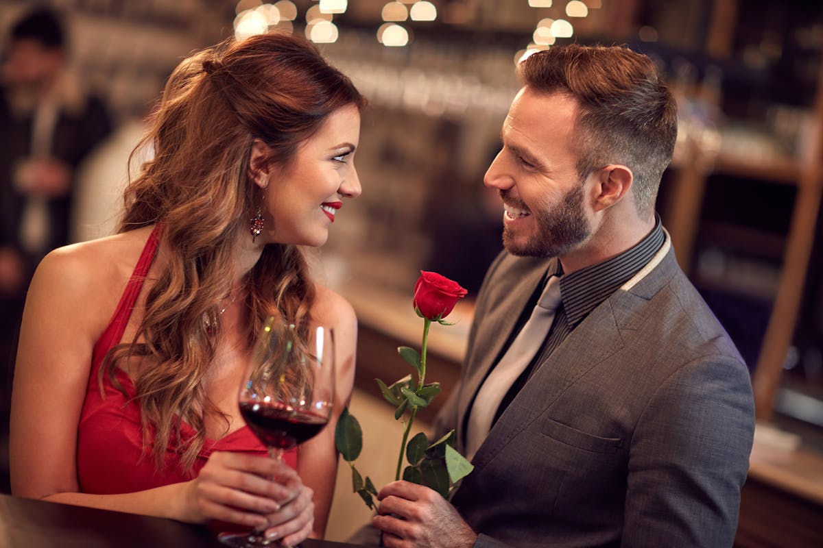 a person holding a glass of wine