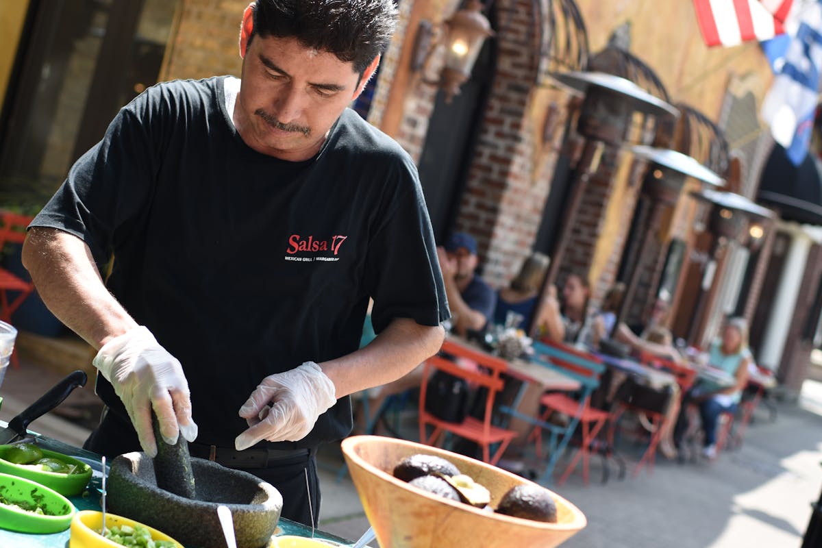 a man cutting food on a table