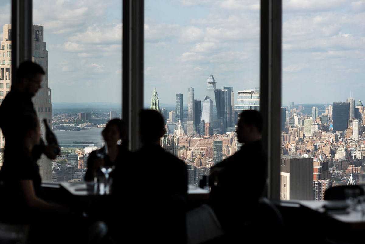a group of people in front of a window