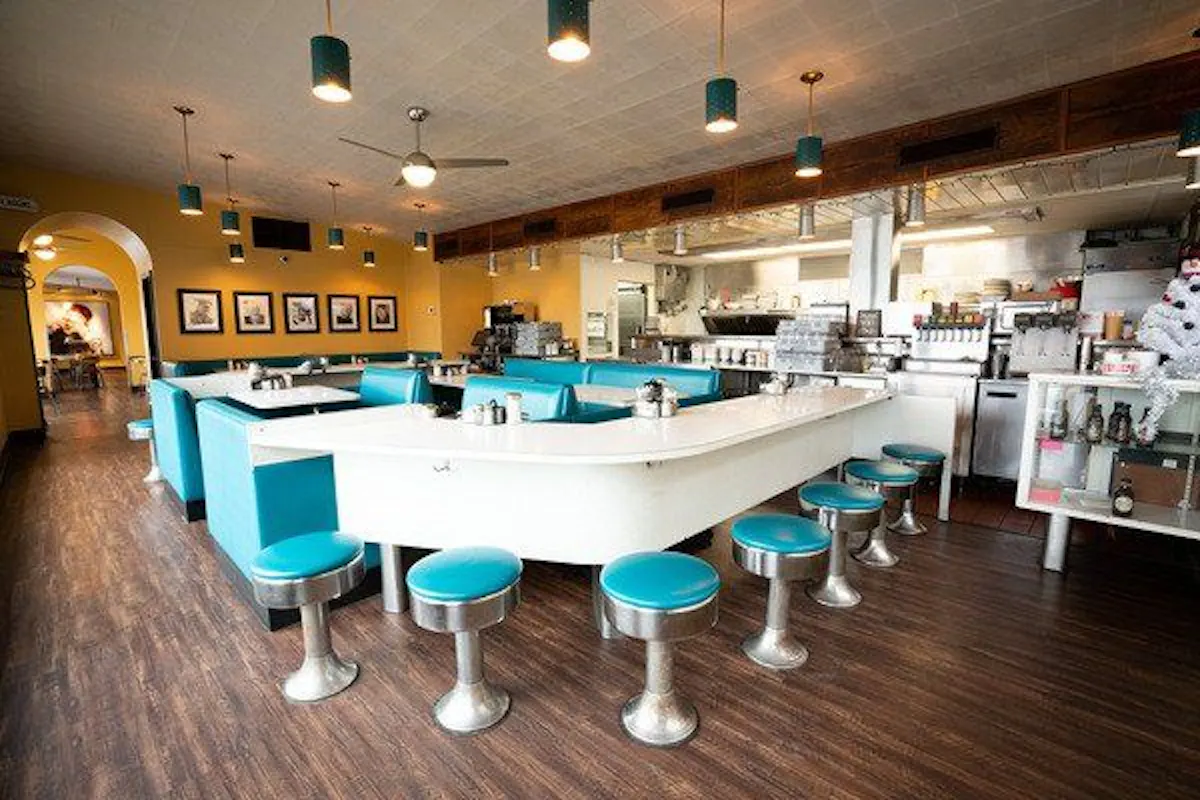 a kitchen with a table in a room