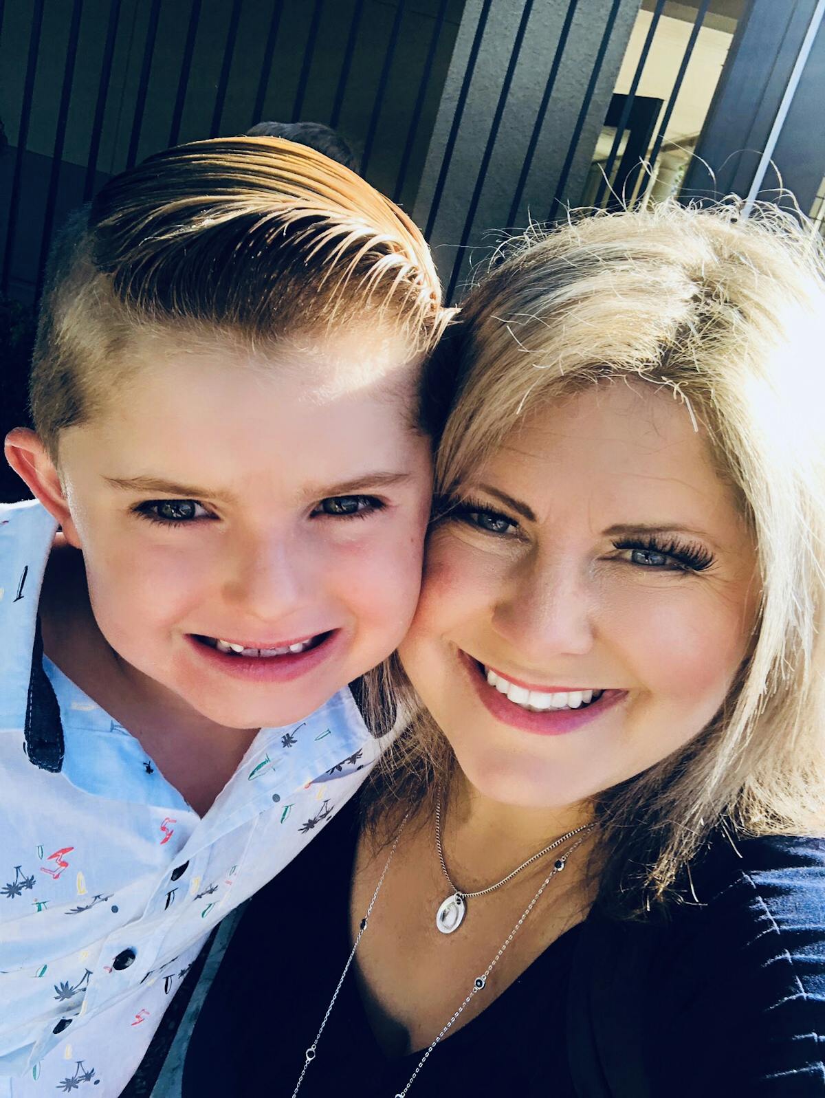 a close up of a boy and girl posing for a photo