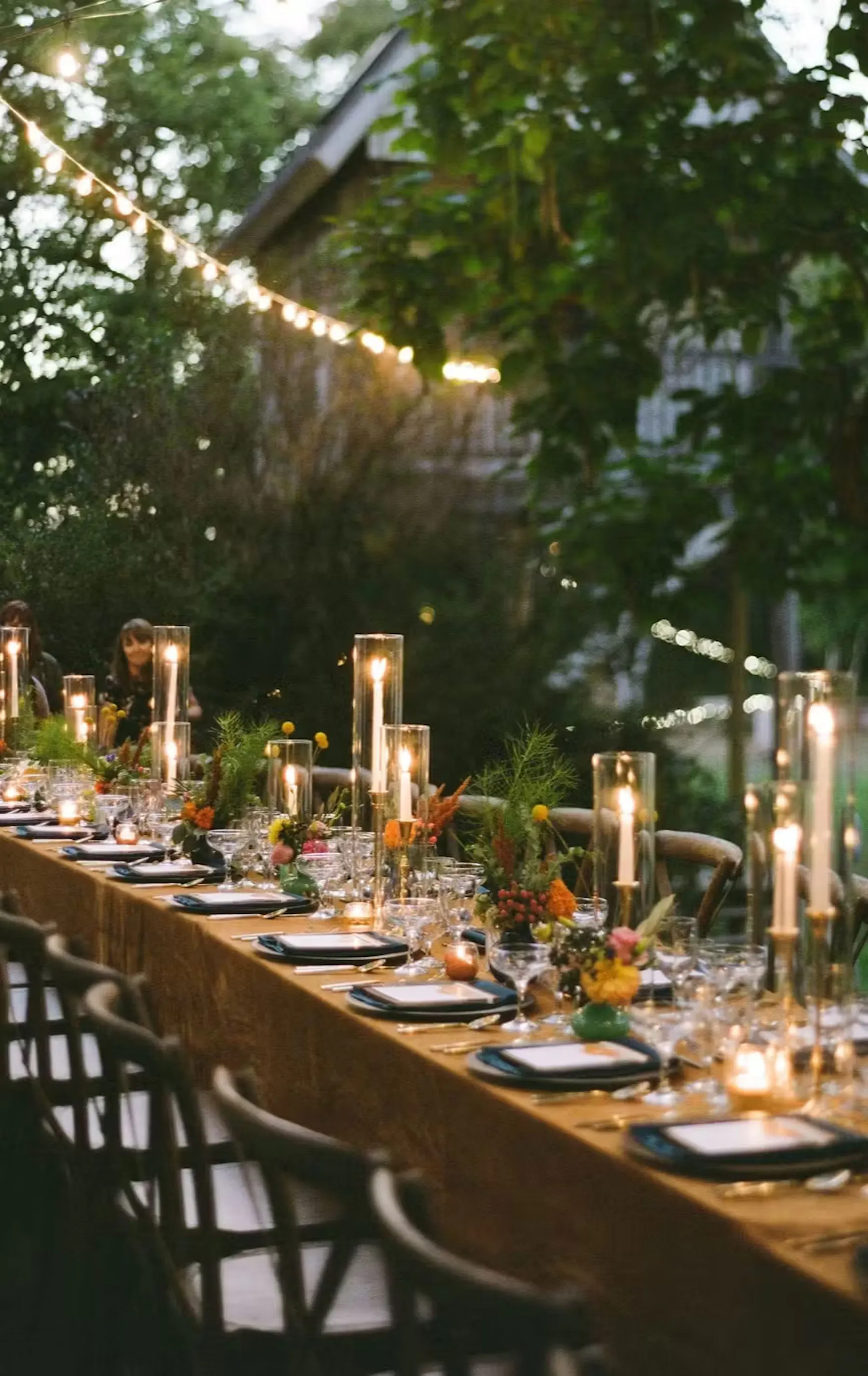 a long table with candles and flowers
