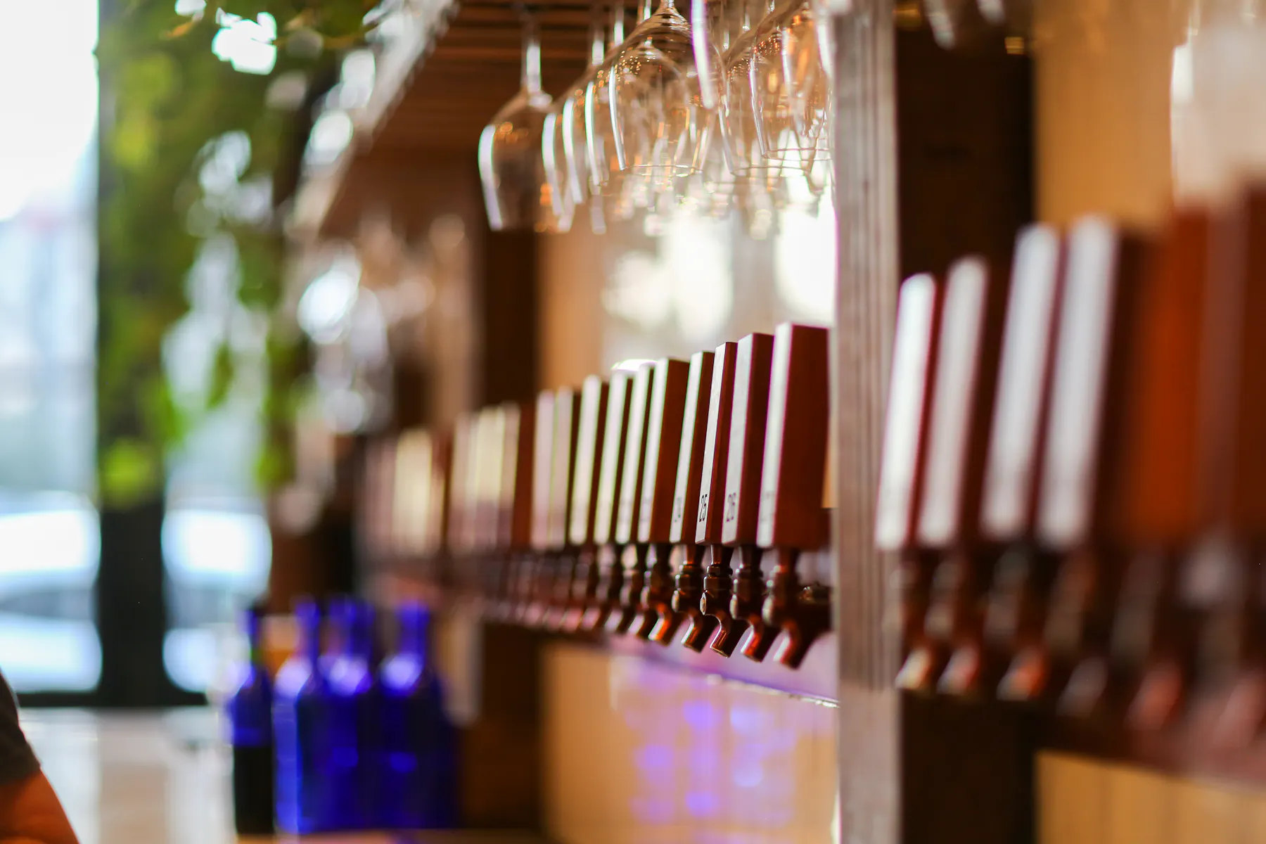 a close up of a bottle and a glass of wine