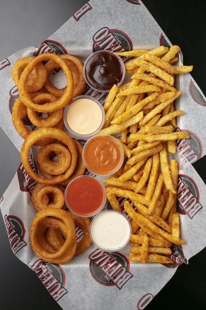 a table topped with a sandwich and french fries