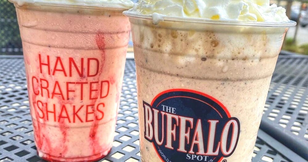 Two Bell, Huntington Park Milkshakes side by side on a table outdoors.