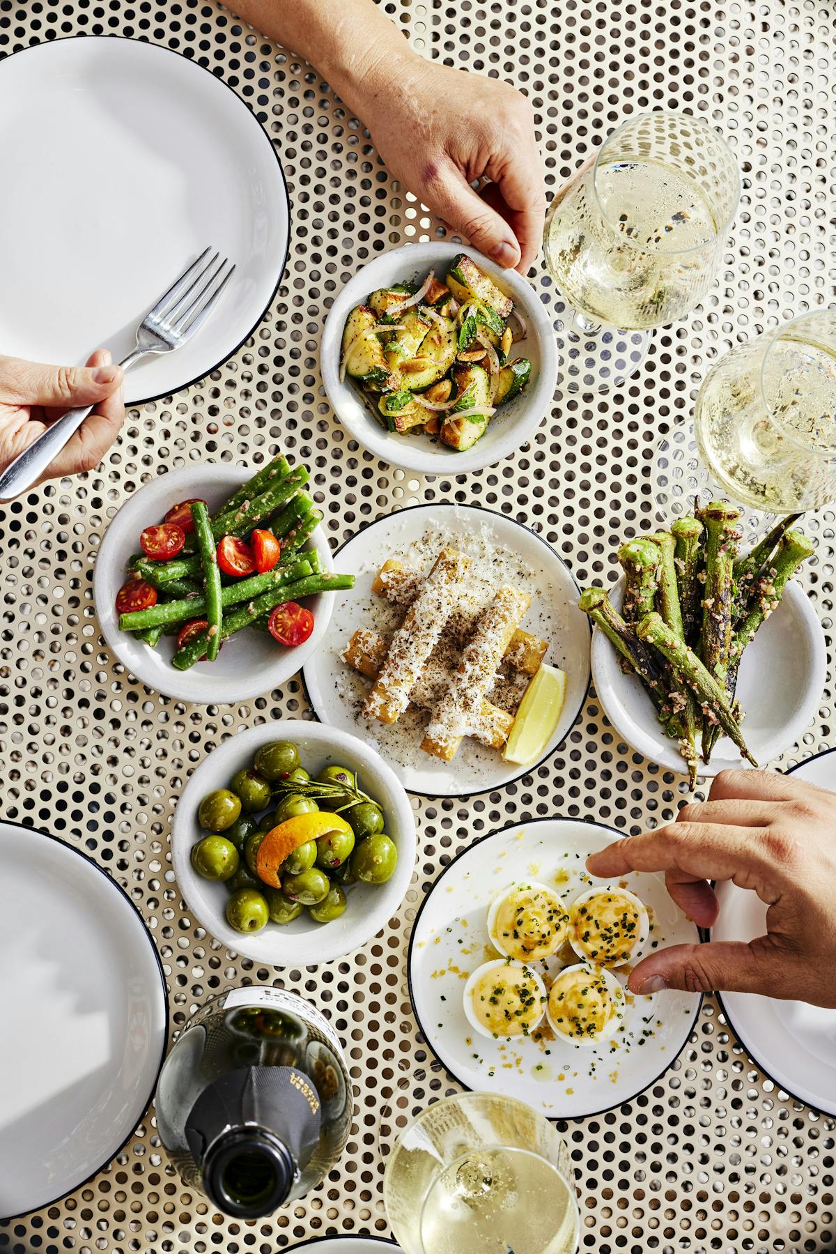 a woman sitting at a table with a plate of food