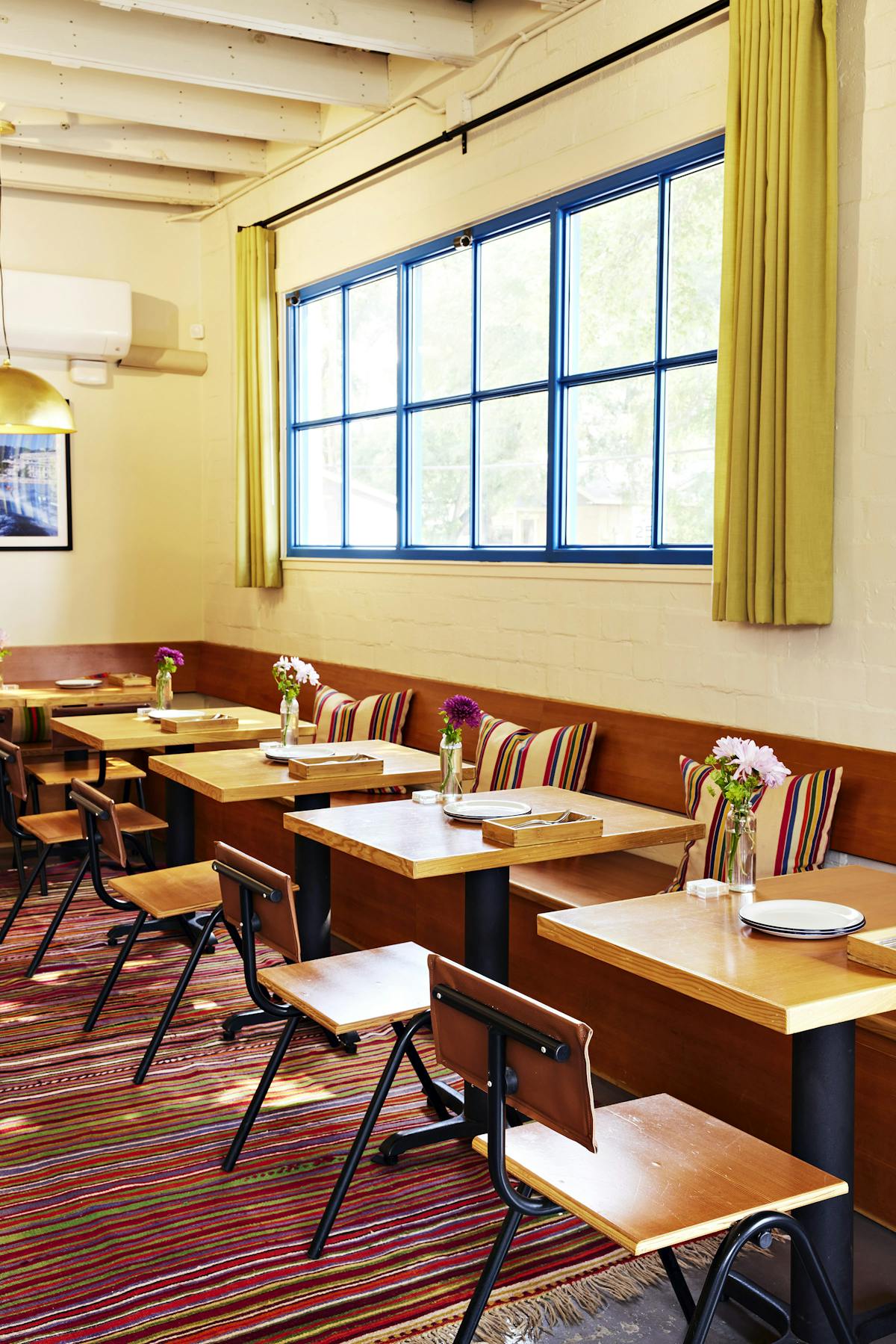 a dining room table in front of a window