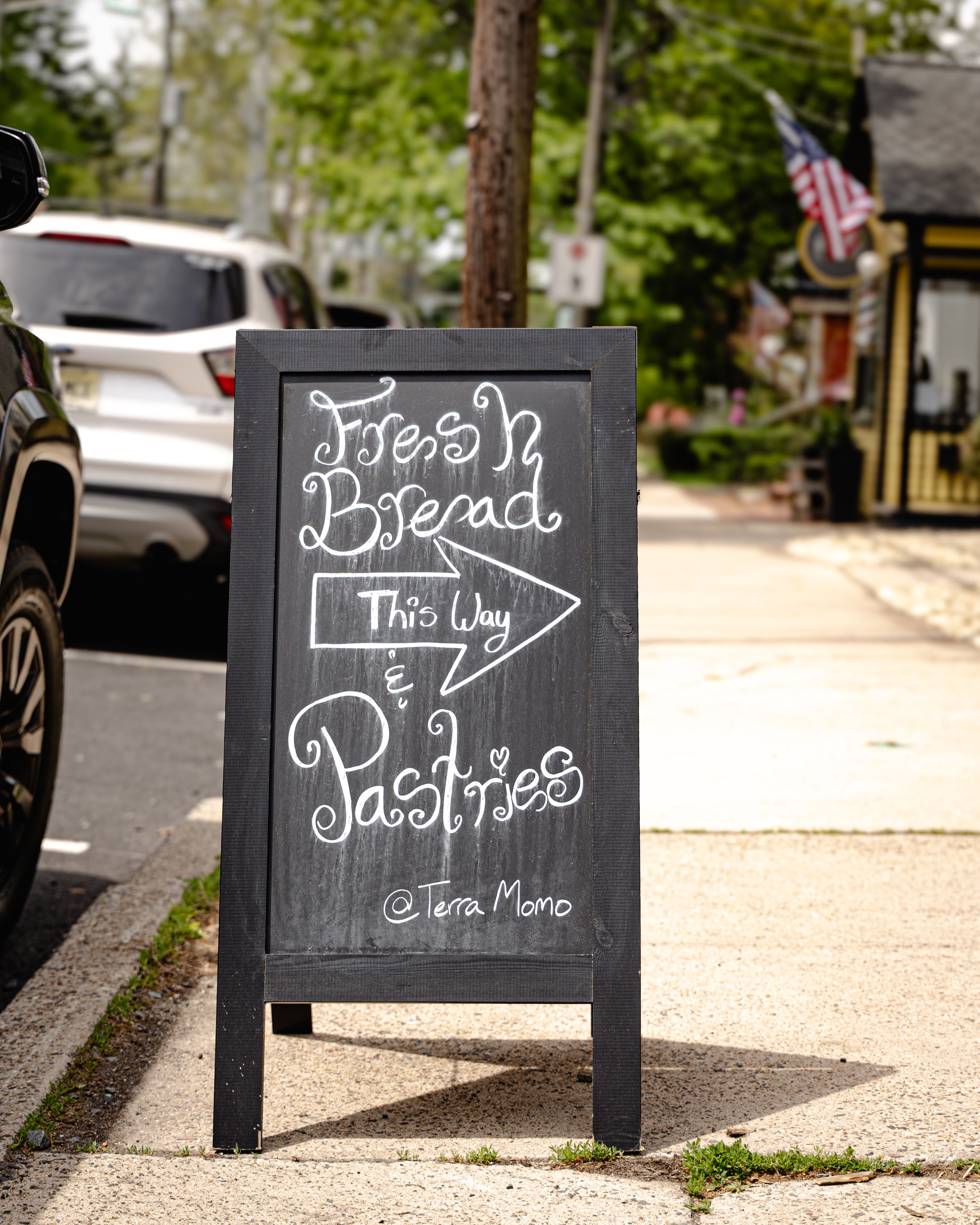 a sign on the sidewalk