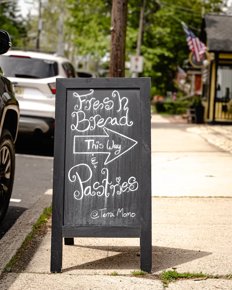 a sign on the sidewalk