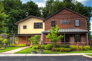 a house on the side of a road