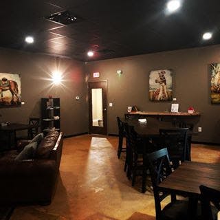 a living room filled with furniture and a table