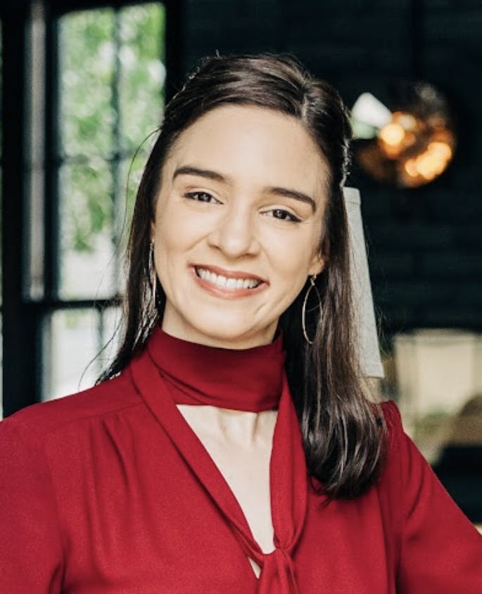 a woman smiling for the camera