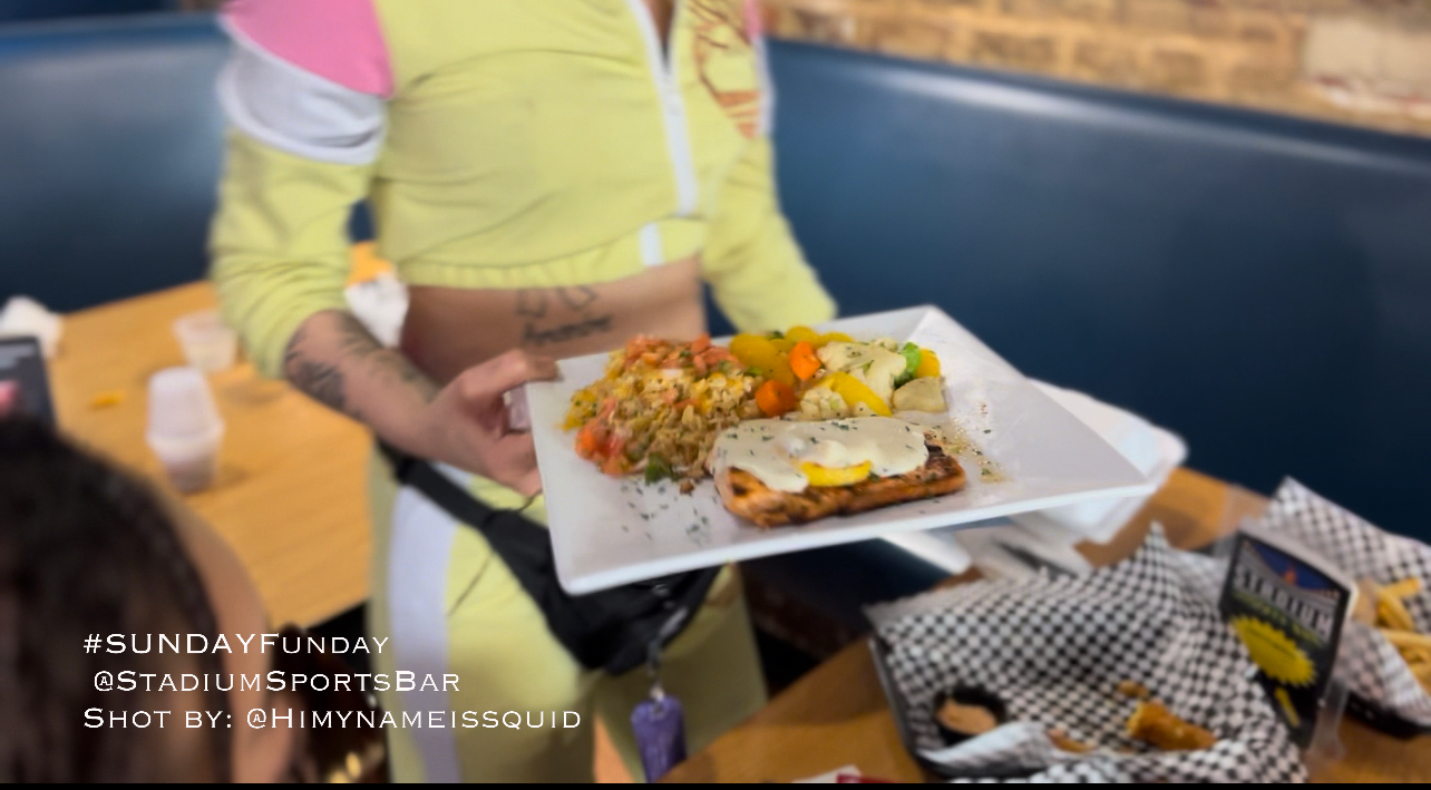 a person sitting at a table with food